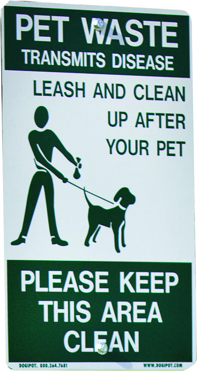 Pet waste sign instructing to leash and clean up after pets. Please keep area clean.