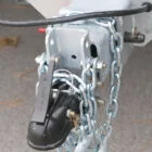 Towing hitch with chain and lock.