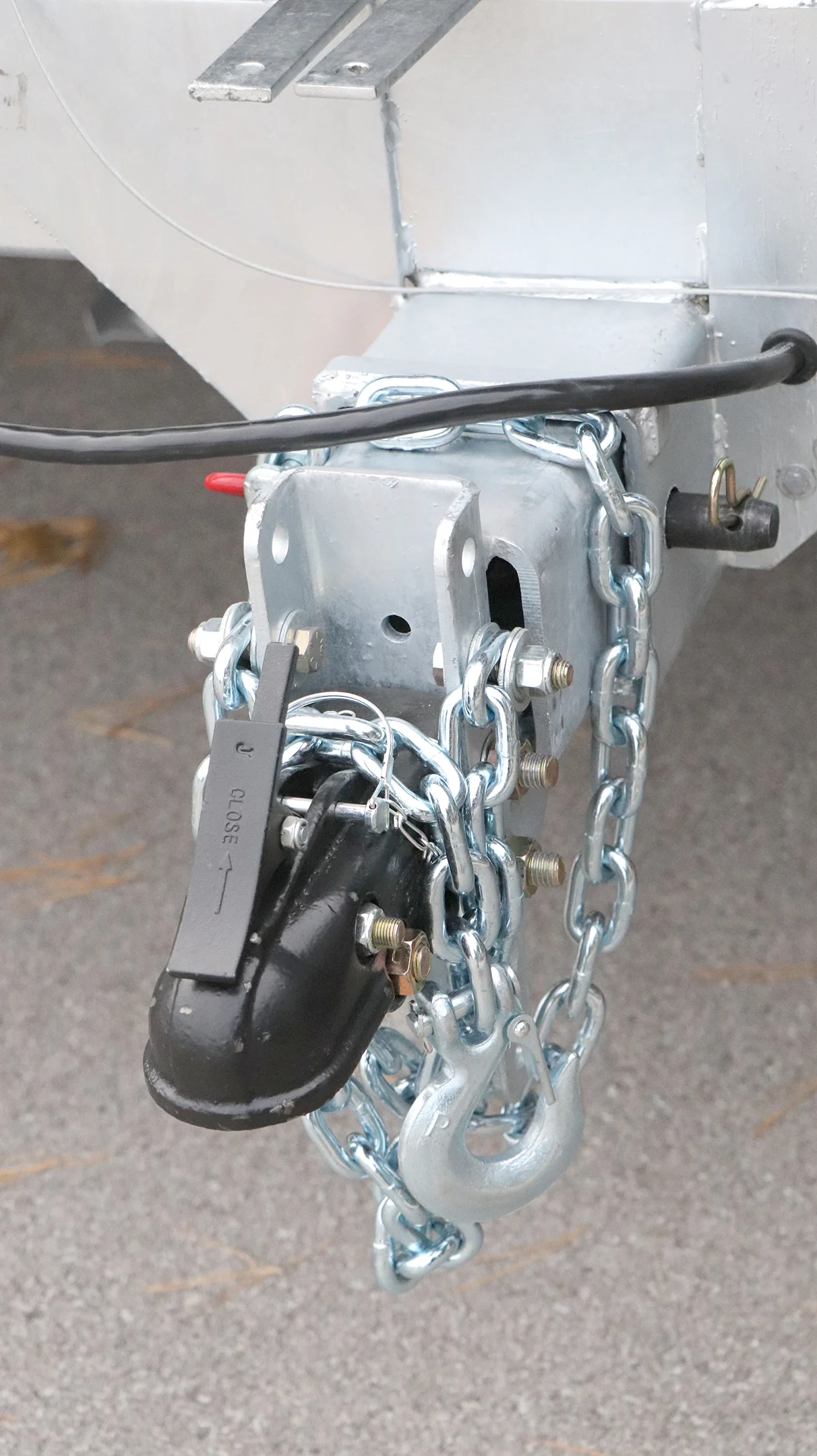 Towing hitch with chain and lock.