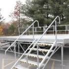 Metal ramp and stairs on a flatbed trailer.