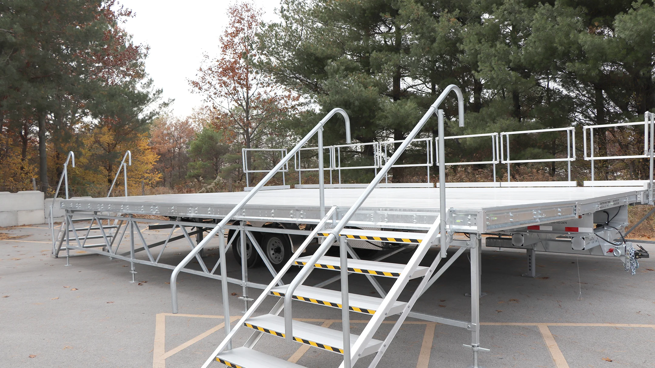 Metal ramp and stairs on a flatbed trailer.