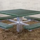 Outdoor green picnic table with metal legs and a textured surface.