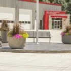 Shell Rock Fire Rescue building entrance with flower pots and benches.