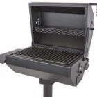 Portable outdoor grill on a stand.