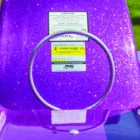 Purple inflatable pool float with safety instructions and capacity label.