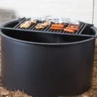 Outdoor grill cooking chicken and sausages.