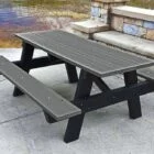 Outdoor picnic table by a lake.