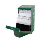 Green trash bin with a pull-out tray and white bags inside.