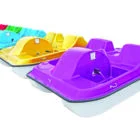Colorful paddle boats in a row.