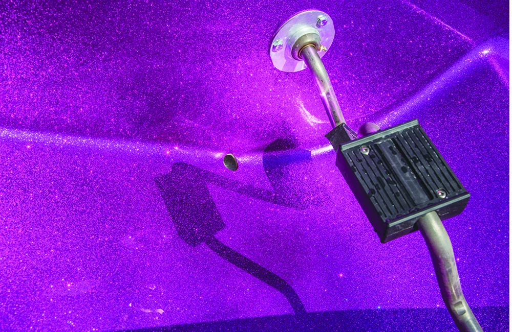 Purple light projector on a purple surface.