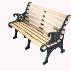 Wooden bench with ornate metal armrests and legs.