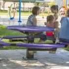 Children playing at a park playground.