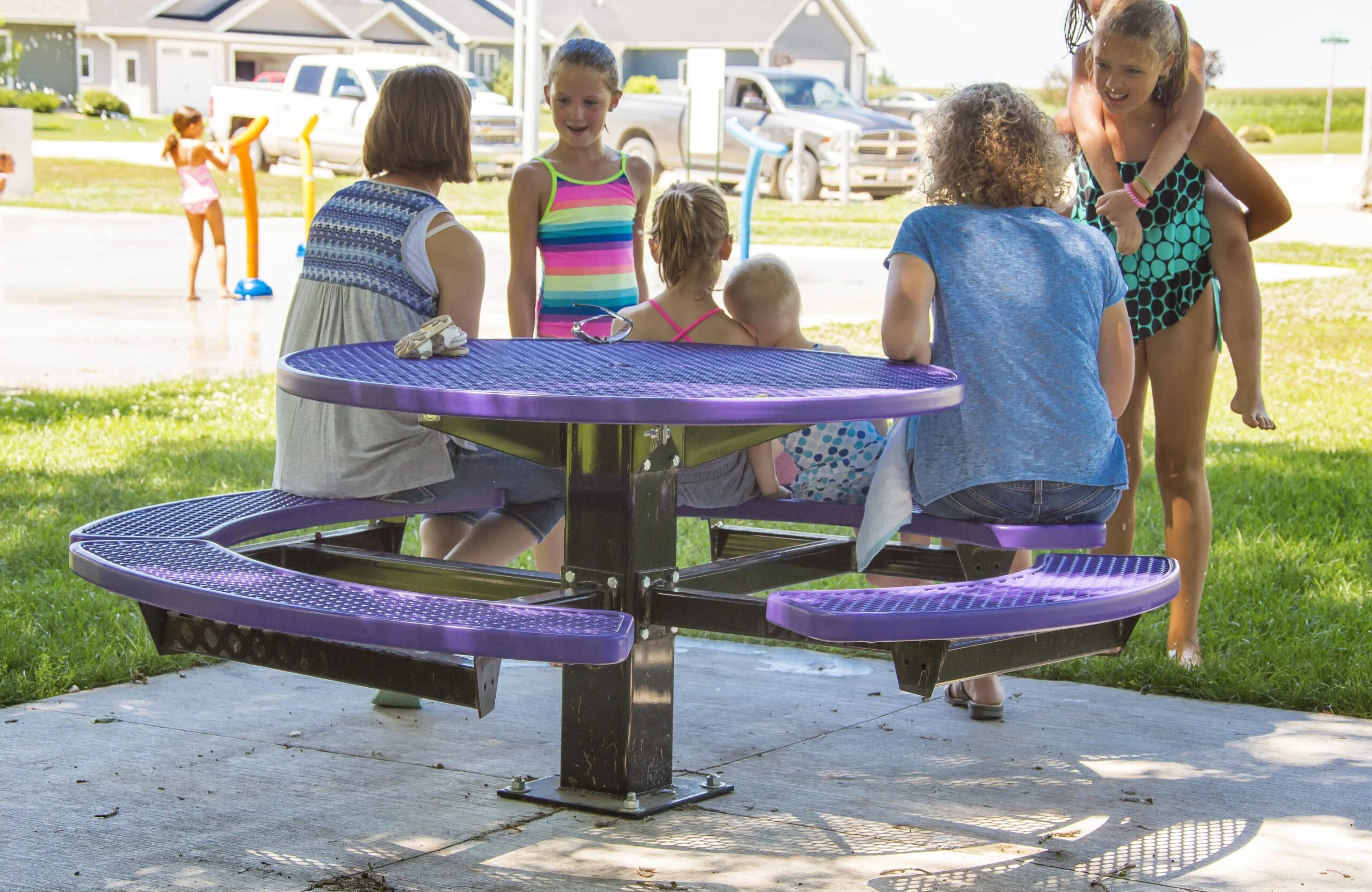 Children playing at a park table.