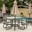 Outdoor patio furniture near a pool.