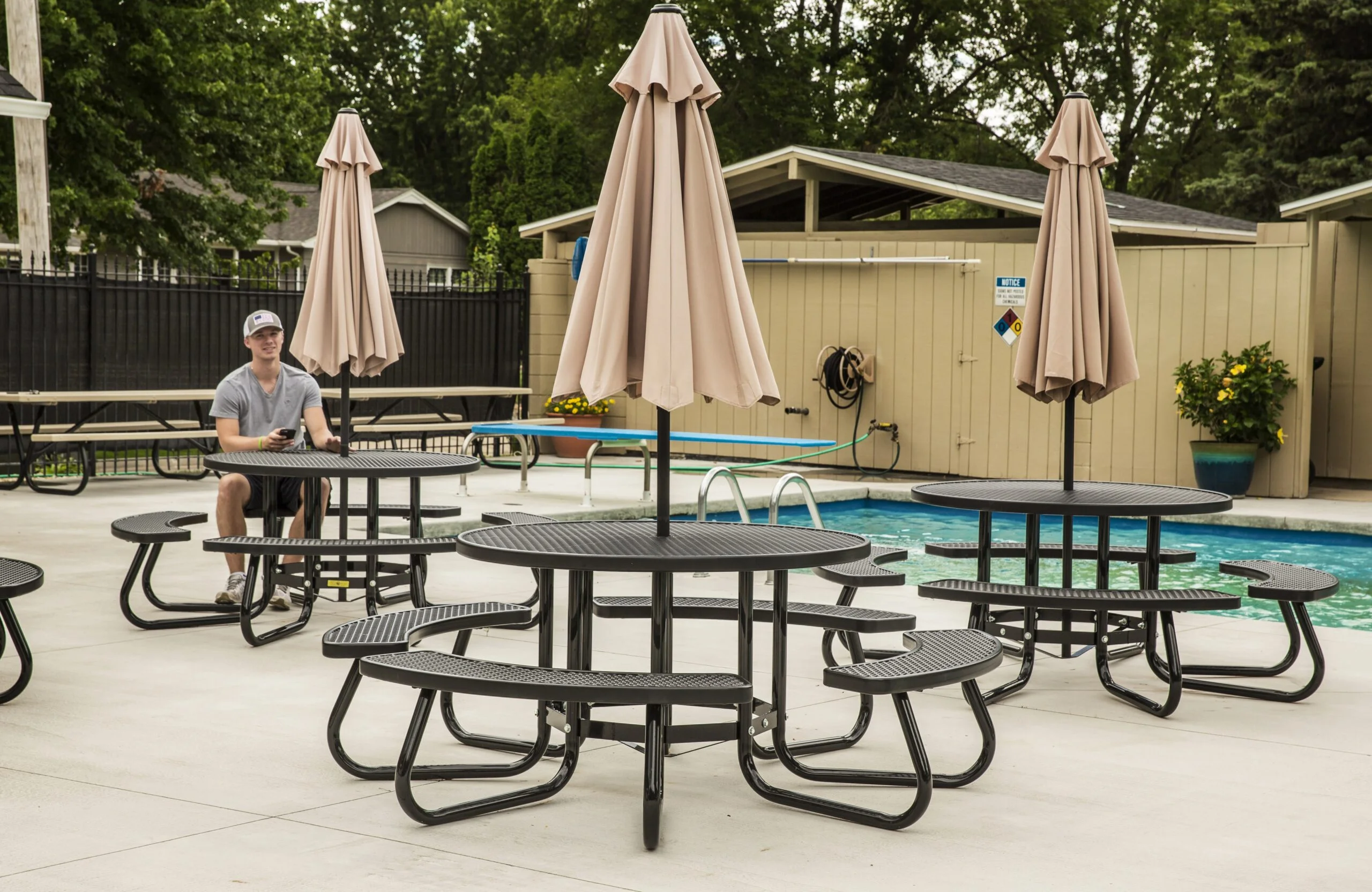 Outdoor patio furniture near a pool.