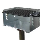 Portable metal grill on a stand.