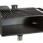 Black grill with metal grate and chimney.