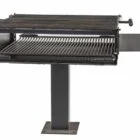 Outdoor grill on a stand.