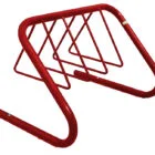 Red metal bike rack on a white background.