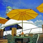 Yellow umbrella on a boat deck.