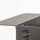 Metallic grill chimney with a sleek design.