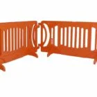 Orange plastic barrier fence segments.