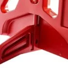 Red plastic object with cutouts and handles.