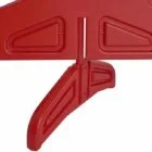 Red plastic object with a handle and cut-out shapes.