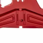 Red plastic object with cut-out shapes and a hole in the center.