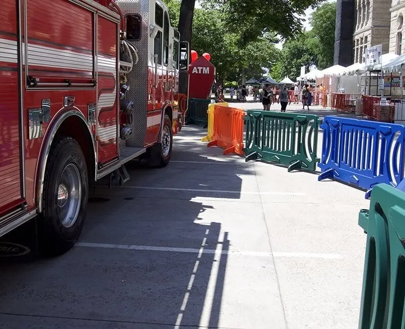 Red fire truck parked on a city street.
