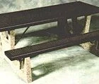Wooden bench in snowy landscape.