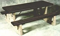 Wooden bench in snowy landscape.