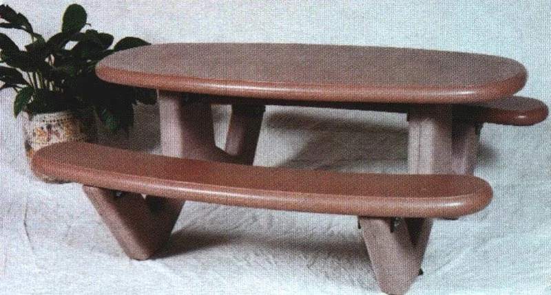 Wooden table and bench set on a white surface.
