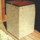 Concrete block on wooden deck.