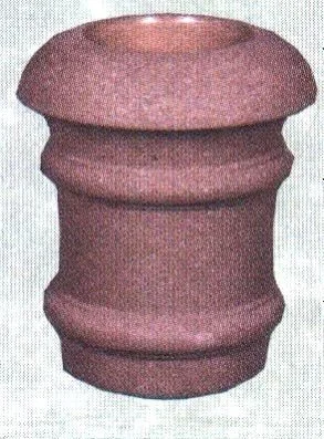 Red cylindrical object with textured surface.