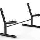 Black metal rack with pegs and rods.