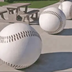 Baseballs in a row on a table.