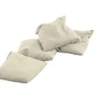 Four beige pillows on a white background.