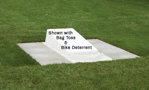 Golf tee shown installed in grass.