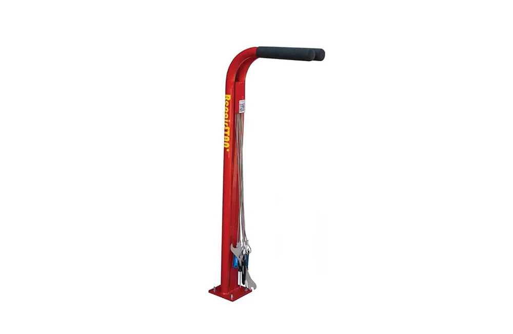 Red metal pole with a handle and attached tools.