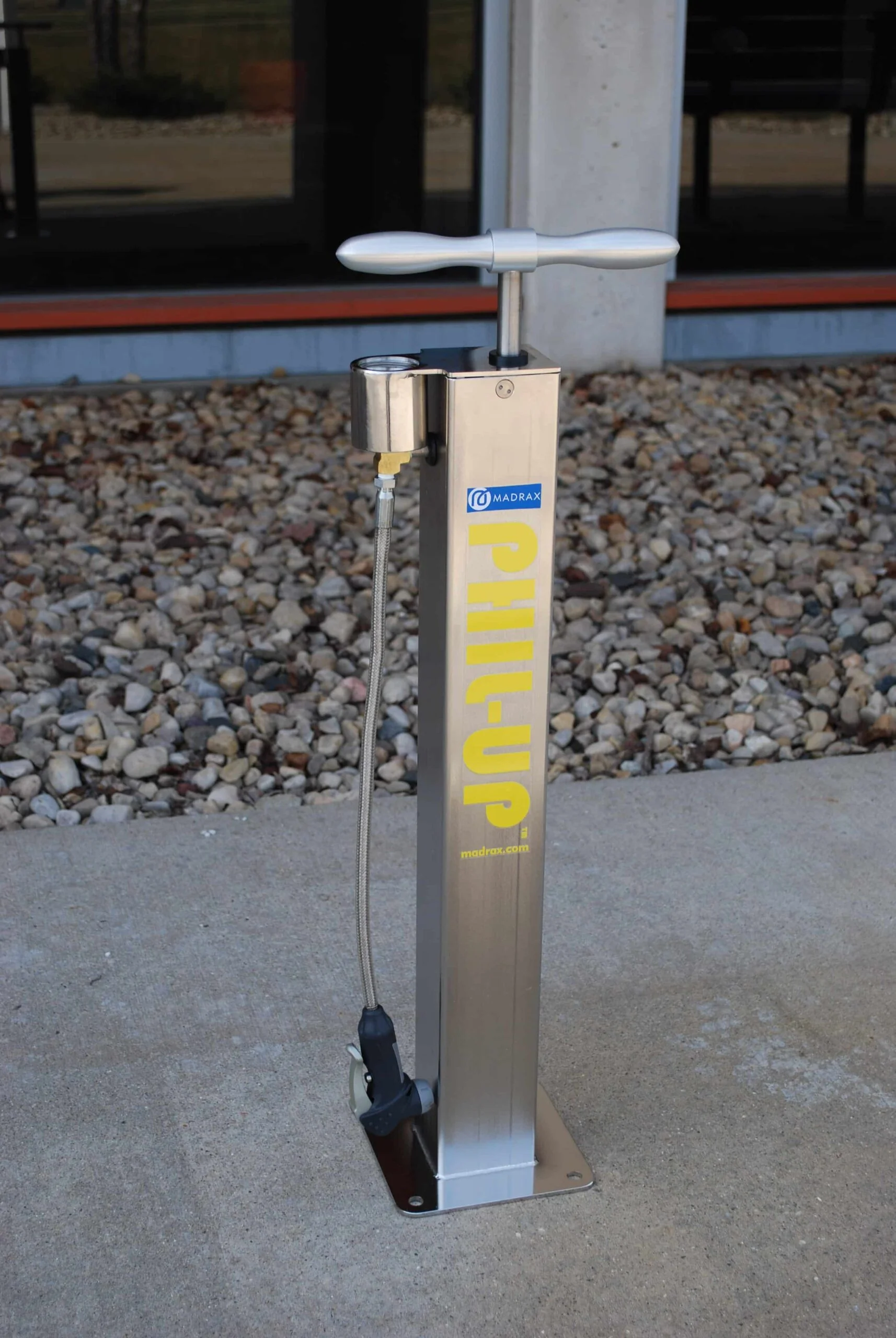 Electric parking boot jack on a concrete surface.