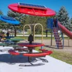 Solar-powered playground equipment in a park.