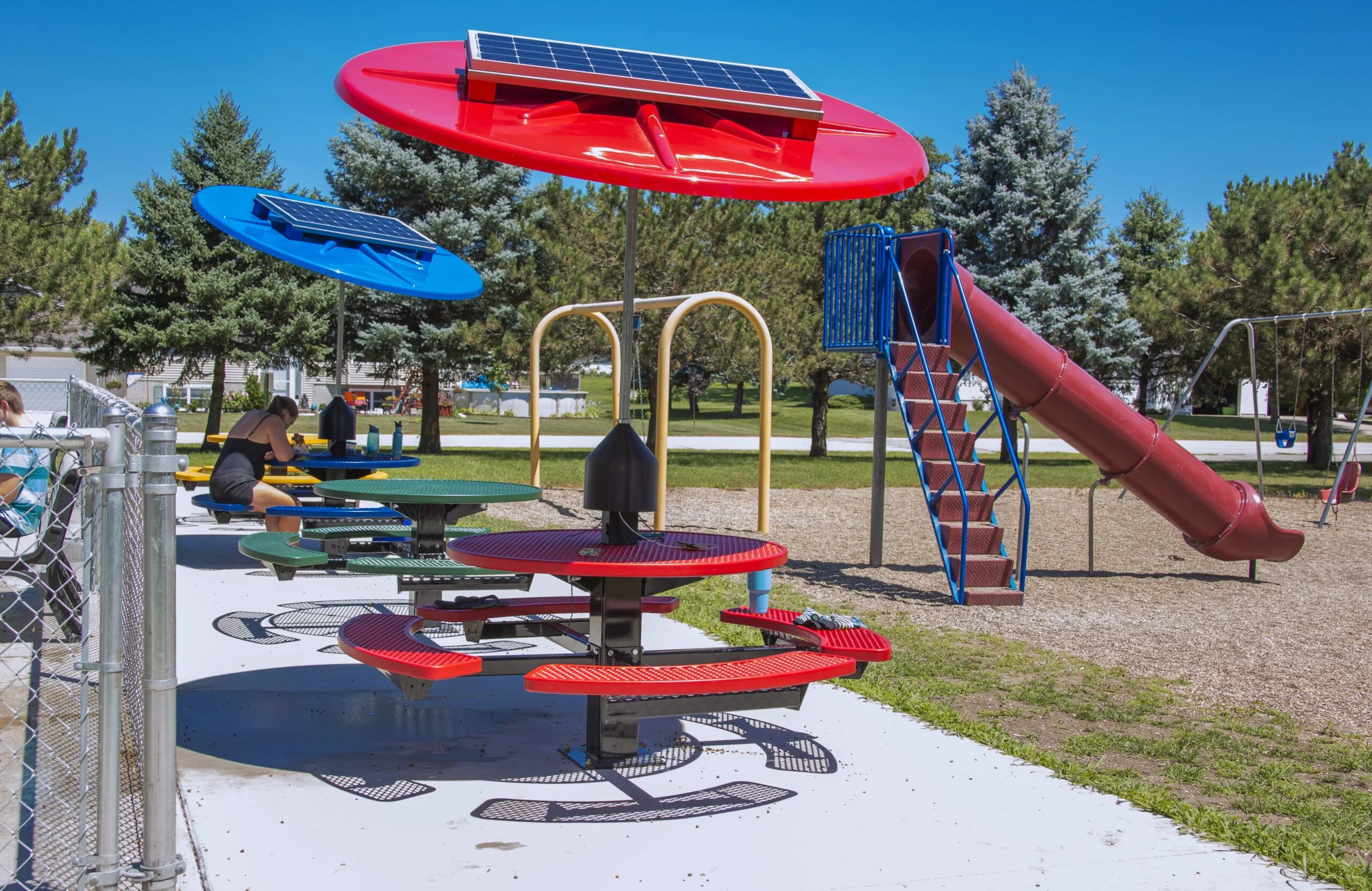 Solar-powered playground equipment in a park.