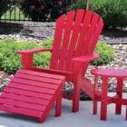 Red Adirondack chair and side table set.