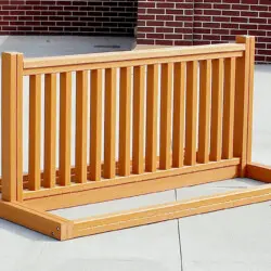 Wooden outdoor planter box on a patio.