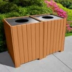 Recycling bin with wooden panels and pink flowers in background.