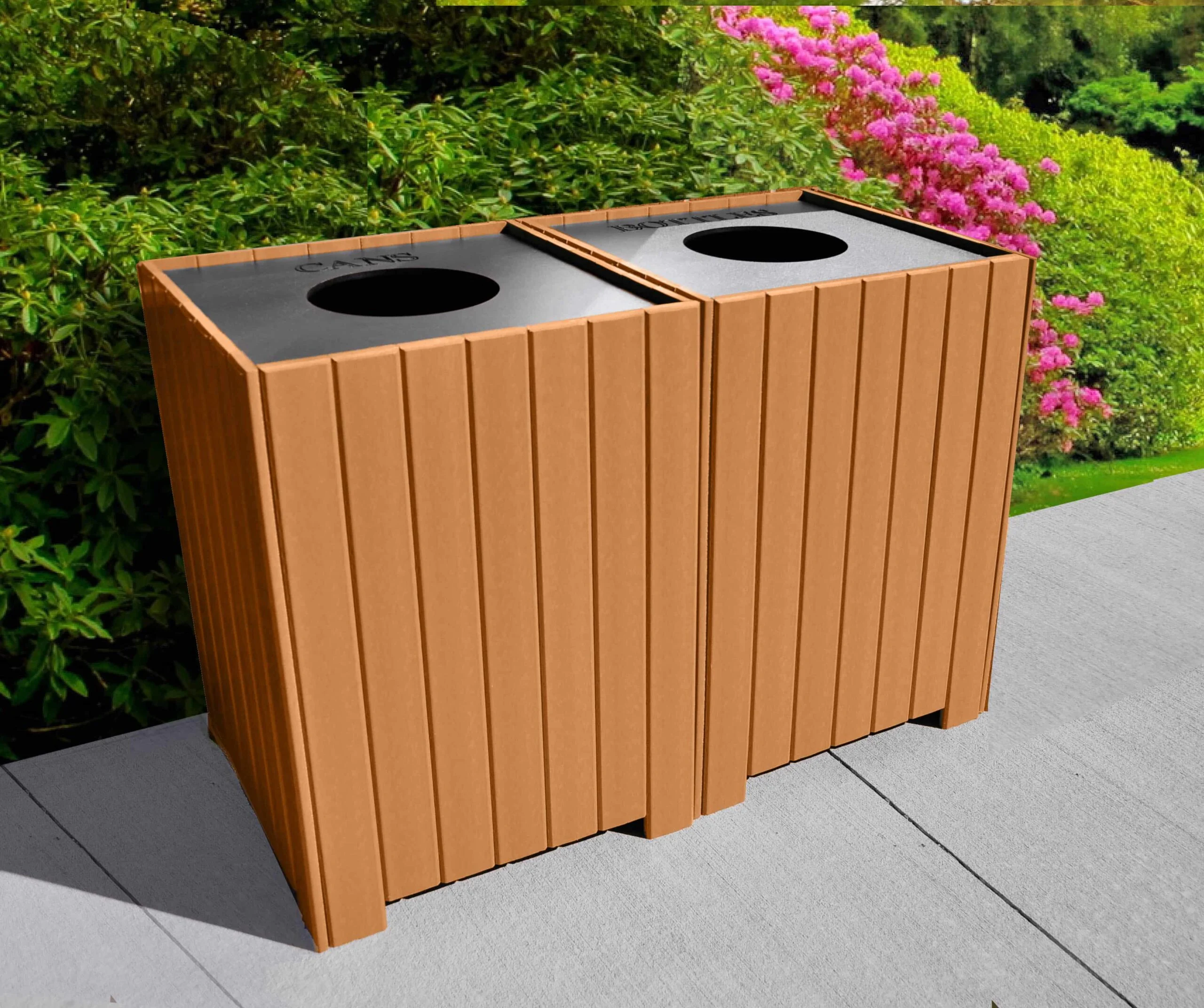 Recycling bin with wooden panels and pink flowers in background.