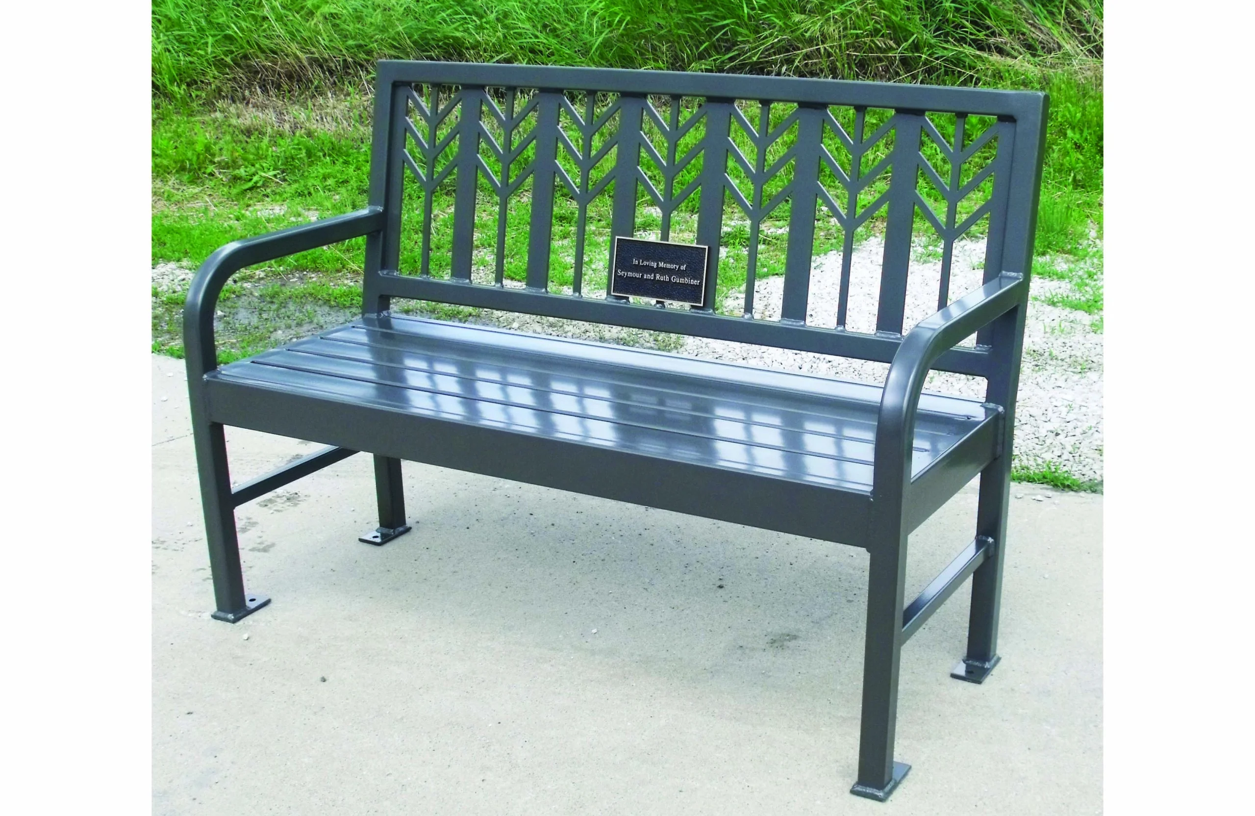Metal park bench with decorative backrest and armrests.