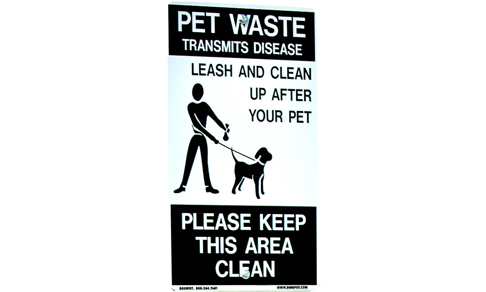 Pet waste sign: leash and clean up after your pet. Please keep this area clean.
