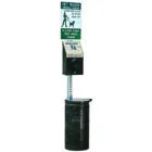 Pet waste disposal station with sign and dispenser.
